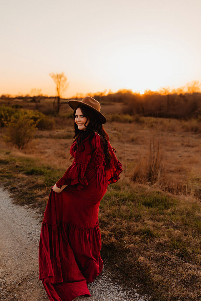 Photographer Andrea Moore of Love to the Moon Photography poses for a photo at sunset at Busch Gardens in St. Louis Missouri.